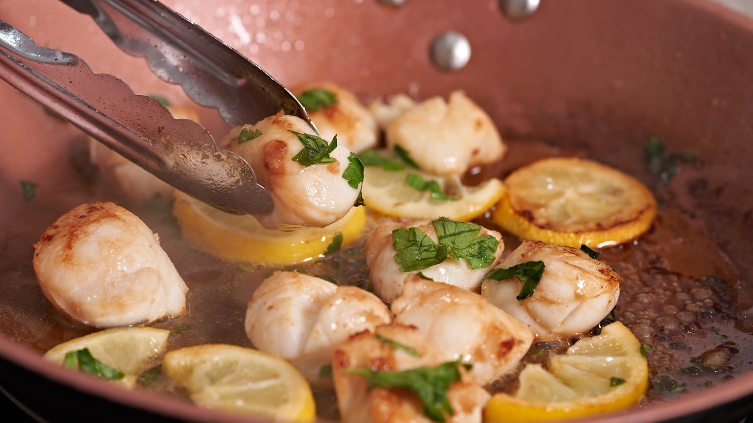 Lemon garlic scallops cooked in ghee served in a bowl, styled gourmet seafood dish showing rich texture and buttery finish prepared using infused ghee in a clean food photography setup